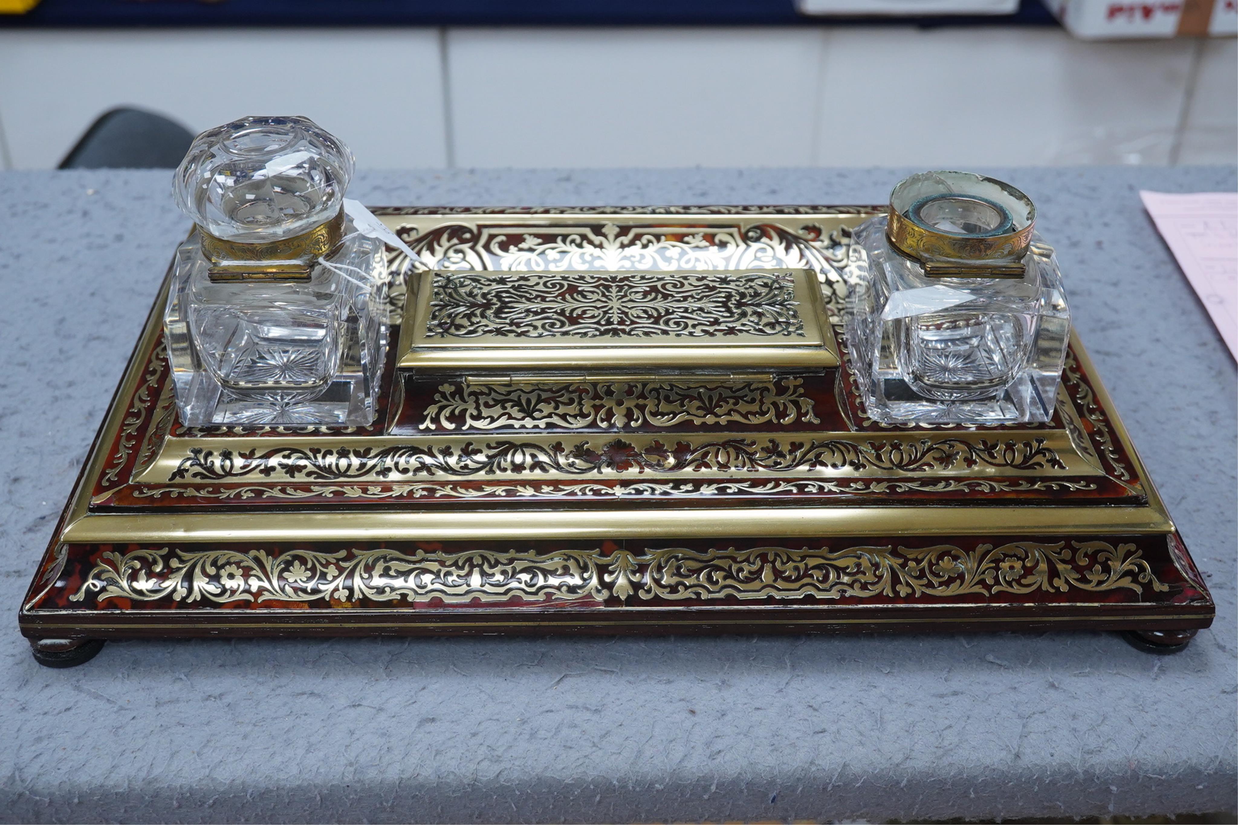 A French scarlet boullework double inkstand with original glass ink bottles c.1850, 39cm wide. Condition - inkstand good, one inkwell cover missing